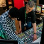 Photo of university apprentice being directed in sound engineering